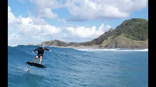 cyclone swell foiling with dolphins