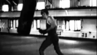 Jack Dempsey Hits Heavybag