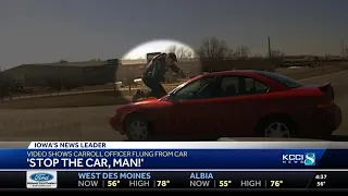 Officer clings to roof of suspect's car in new video of a Carroll car chase