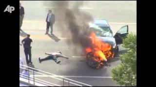 Raw Video: Burning Car Lifted Off Trapped Man