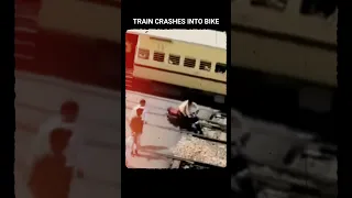 Close Call Chronicles: Reckless Biker Takes on a Train - Shocking Collision!