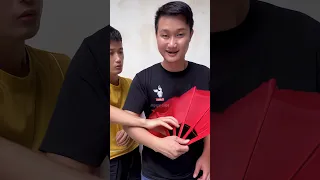 Red folding fan magic