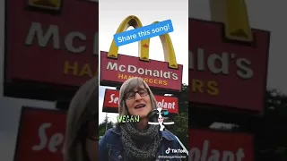 Miss Karen sings a vegan song in front of McDonald’s