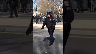 Cop dances at E-A-G-L-E-S parade