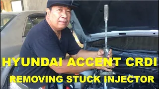 HYUNDAI ACCENT CRDI ENGINE. REMOVING STUCK FUEL INJECTOR USING SHOCK PULLER SPECIAL TOOL.