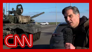 Russian tanks roll past CNN reporter as they appear to head towards Ukraine