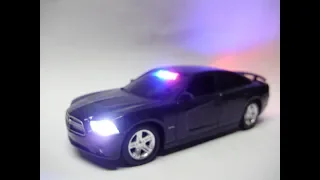 Reagan's unmarked Dodge Charger Pursuit police diecast model with working lights
