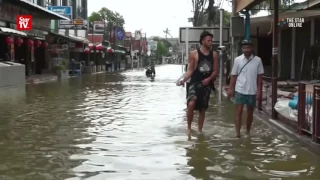 Over a dozen killed in Thai floods as heavy rain hits tourism season