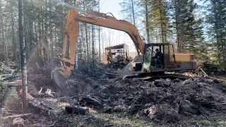 Digging with the excavator, looking for gravel to fix the driveway