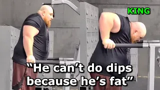 Fat man trying to do dips..