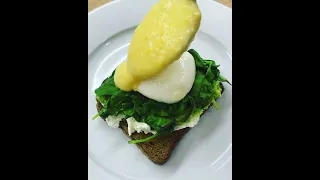 Poached Eggs in Hollandaise Sauce with Avocado and Spinach - Delicious Breakfast - Recipe Below