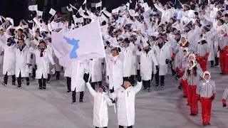 Olympics Begin with Unified Korean Team Marching Together as Trump Continues to Threaten N. Korea