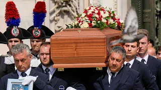 Silvio Berlusconi's coffin arrives at a Milan cathedral for state funeral