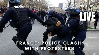 LIVE: Police and protesters clash in Paris over pension reforms