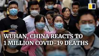 China’s Wuhan moves on as global coronavirus death toll passes 1 million