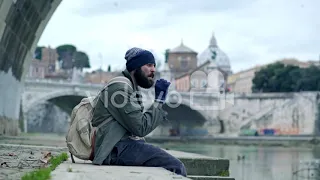 Homeless Man Smoking A Cigarette near the river　松下裕城