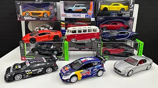 unboxing brand new boxes of Classic Bburago diecast model cars in a scale of 1:32