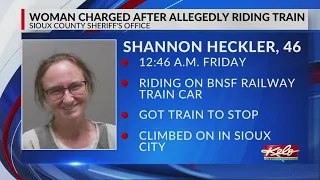 Woman charged after allegedly riding train