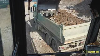 Doosan DX380LC-5 excavator loading Man truck with blasted rock - cab view