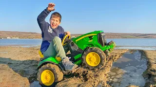 Excavator digging dirt near the lake and Darius wants to save people from water | Kidscoco Club