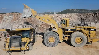 Huge Caterpillar 994 Wheel Loader Loading Caterpillar 777F Dump Truck - Samaras Mining Group