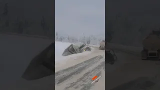 Trucker trying to maneuver around crash takes a tumble down a snowy hill #americantruckdrivers