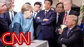 G7 photos of Trump with Merkel tell different stories