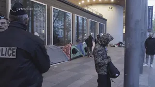 With the Olympics approaching, police officers evict migrants from a makeshift camp in Paris