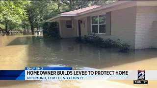 Homeowner builds levee to protect home