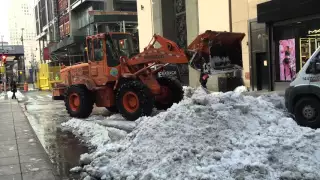 DSNY, NEW YORK CITY DEPARTMENT OF SANITATION, USING FRONT LOADER & DUMP TRUCKS TO REMOVE SNOW.