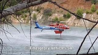 Black Hawk firefighting helicopters refilling at Montacute fire