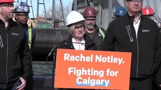 Rachel Notley campaigns at a pipe yard in Calgary