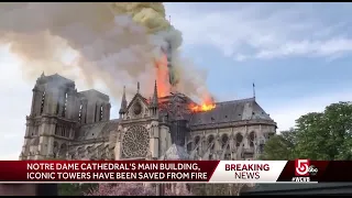 Flames engulf Notre Dame Cathedral in Paris, spire collapses