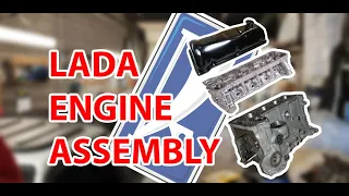 Two rookie mechanics assemble a Lada engine