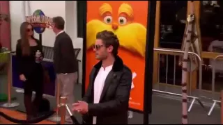 Zac Efron Drops A CONDOM On The Lorax Premiere Orange Carpet