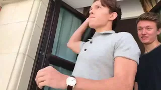 Tom Holland gives autographs on paper planes