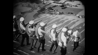 The "Odessa Steps" scene from "Battleship Potemkin" (1928) but it's just soldiers.