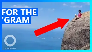 Tourist takes death-defying shot on Brazilian cliff edge - TomoNews