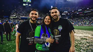 Sounders players celebrate on the pitch after winning CCL