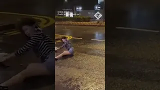 Woman violently thrown to ground by wind during Typhoon Saola in Hong Kong