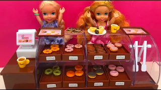 Elsa and Anna toddlers surprise at the donut shop