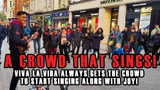 Busker’s Surprise: BIG CROWD SINGS VIVA LA VIDA Together! 🎤👏
