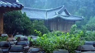 Heavy rain falls on a hanok house