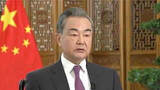 Wang Yi satisfied with China's diplomatic progress in 2021