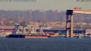 From Baltimore a Barge full of Debris from cleanup of the Francis Scott Key Bridge is hauled away