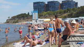 Russia, the Black Sea. The beach is pebbly in the bay. There are a lot of vacationers. No comments