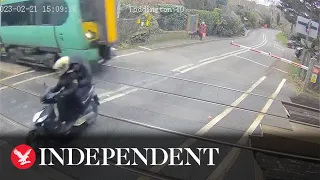 Moped narrowly avoids 70mph train after running level crossing