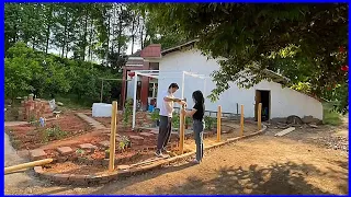 the process of the young couple renovating the old house and garden in the countryside