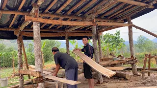 Together with my grandfather, I put together wooden planks to complete the floor for the goat.