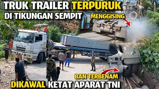 TRUK TRAILER BERMUATAN BERAT TERPURUK DI TIKUNGAN SEMPIT !!! LANGSUNG DIKAWAL KETAT APARAT TNI